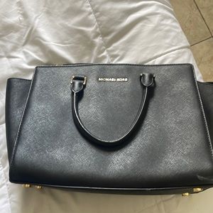 Black Michael Kors purse missing strap